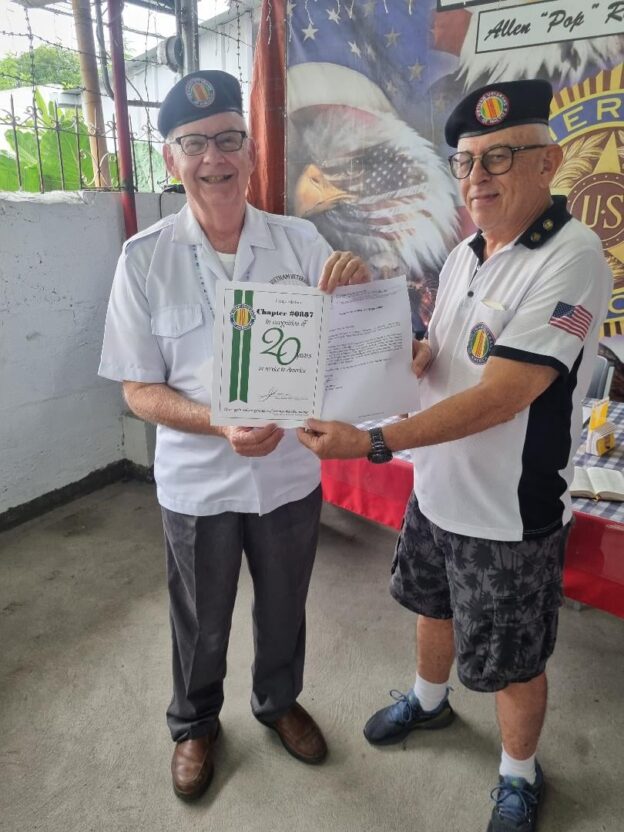 Chapter Secretary Ray Jones presents a Certificate of Recognition & Letter from VVA National President John Rowan